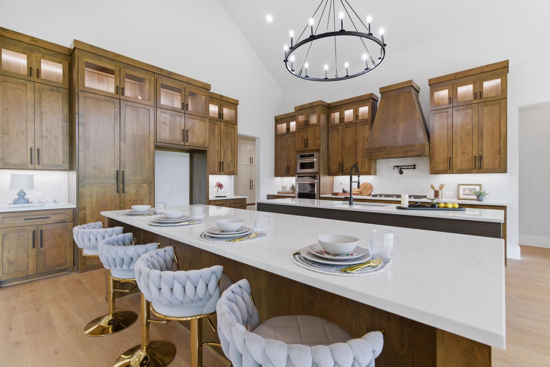 Kitchen with alder cabinetry and dual islands