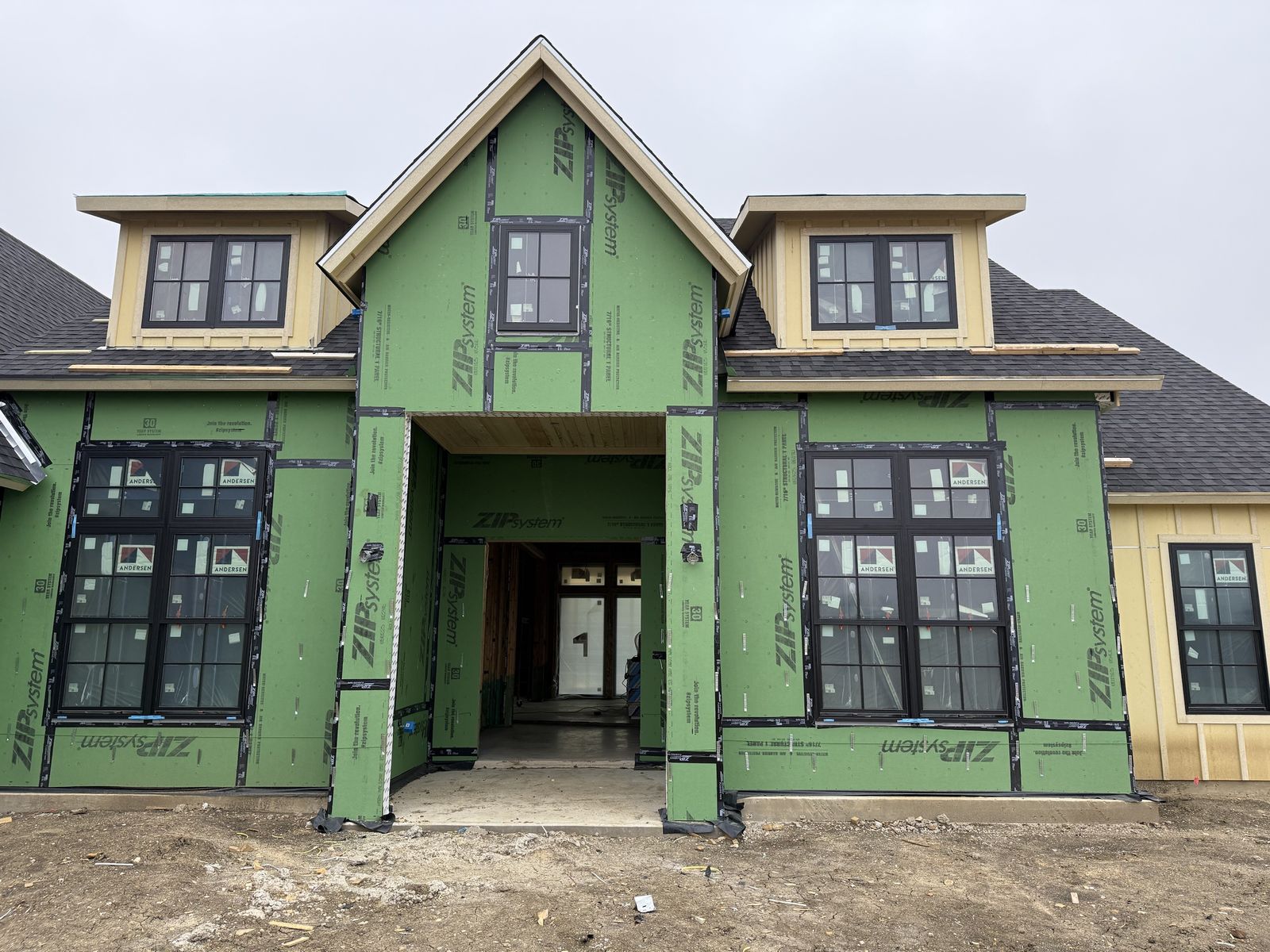 Home dried in with ZIP System sheathing and Andersen windows