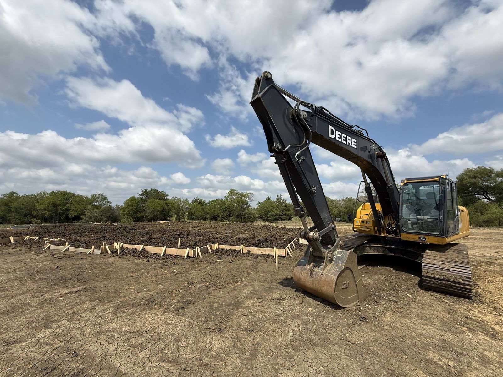 Excavator and foundation forms on a Northlake homesite