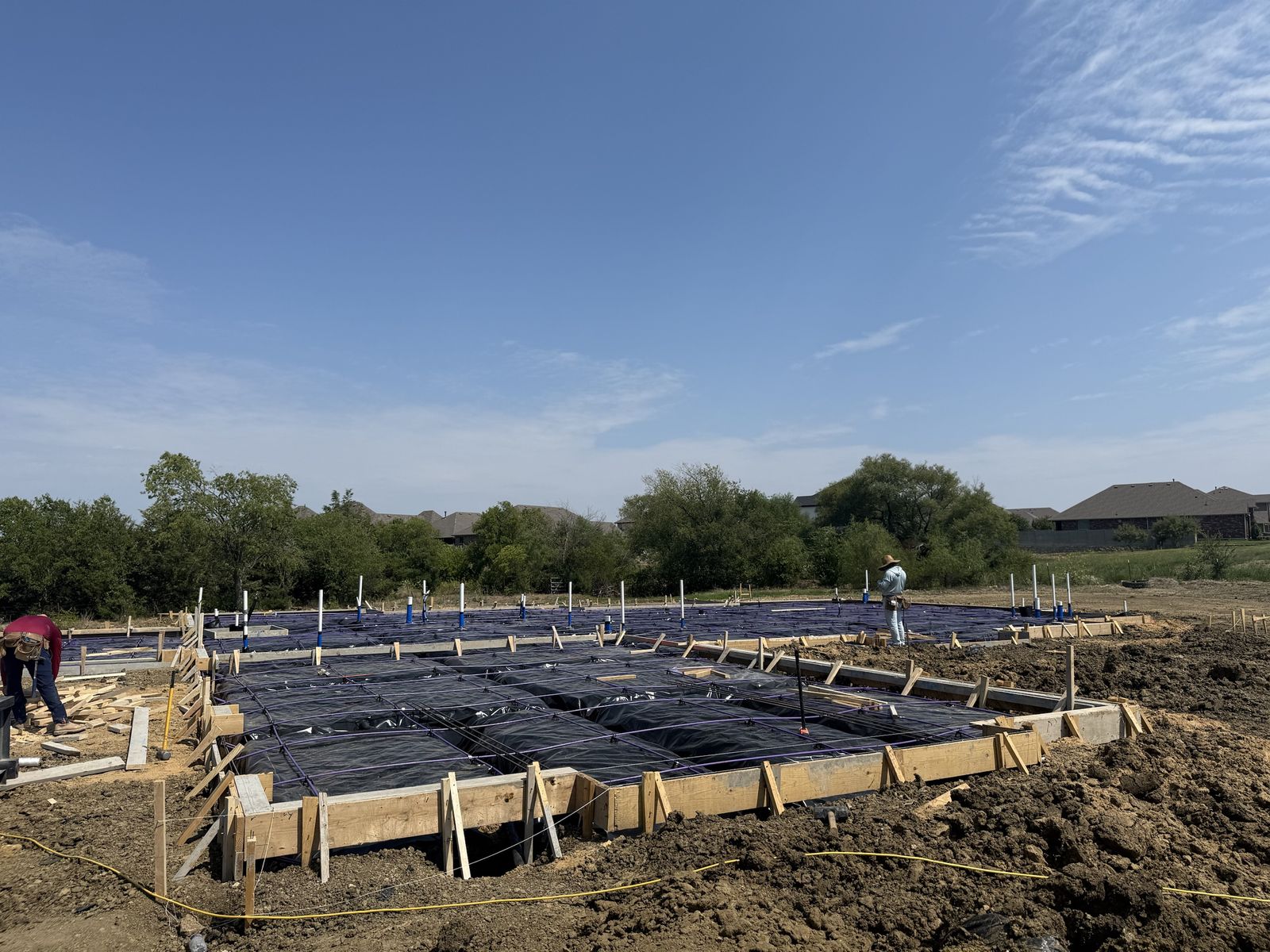 Slab forms, beam trenches and post-tension cables ready for pre-pour inspection
